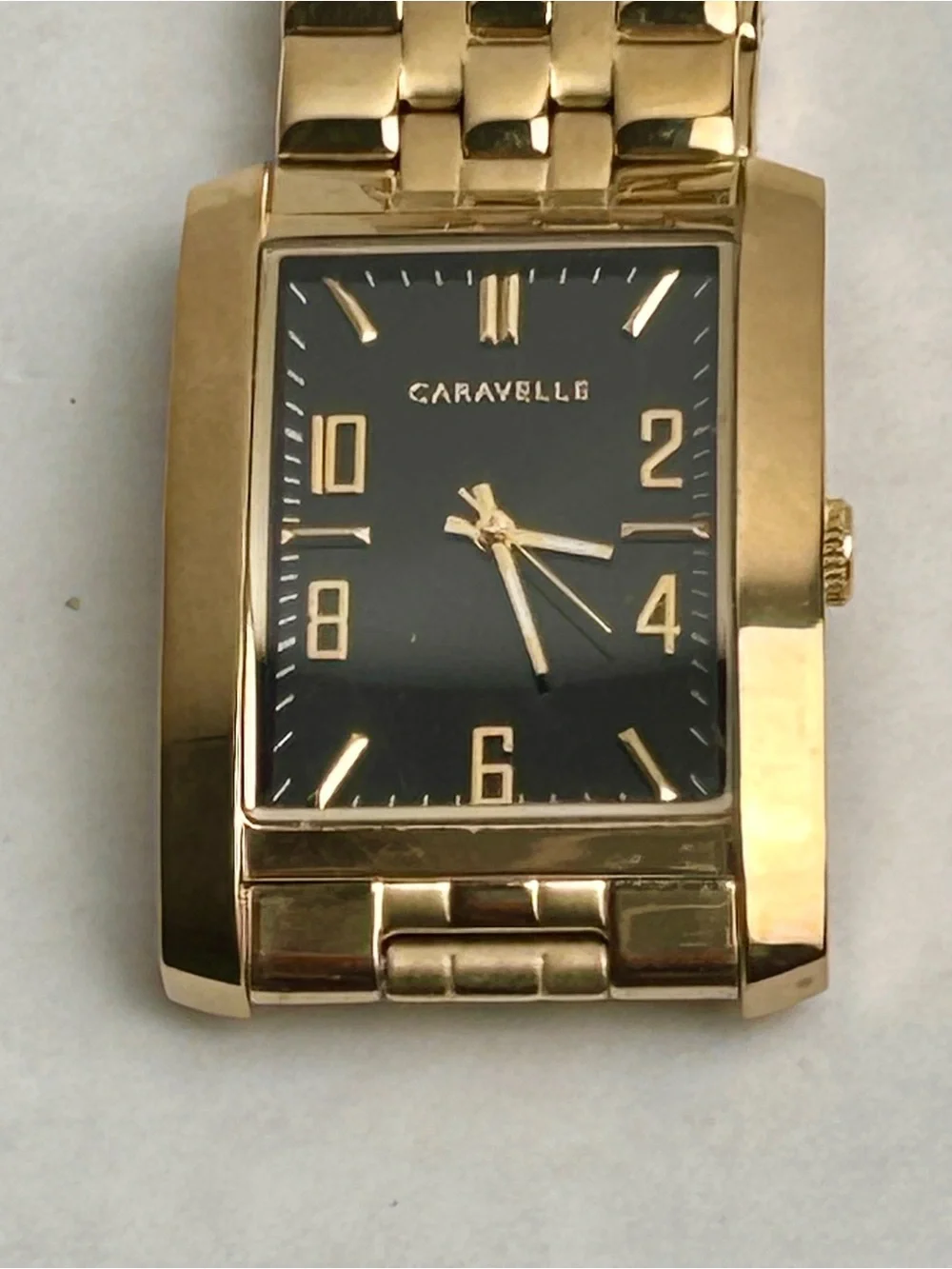 Caravelle by Bulova Men’s Gold Tone Rectangular Bracelet Watch Black dial 44A110